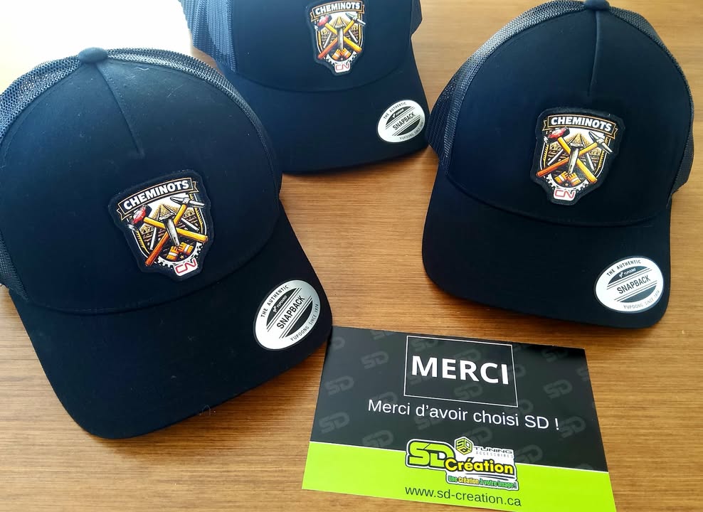 Patches brodées sur casquettes pour l'équipe des cheminots pour le chemin de fer CN . Casquettes personnalisées.